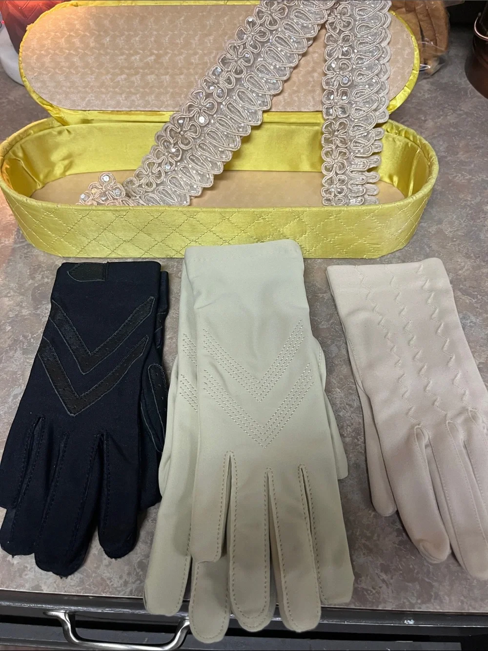 Vintage gloves in storage box